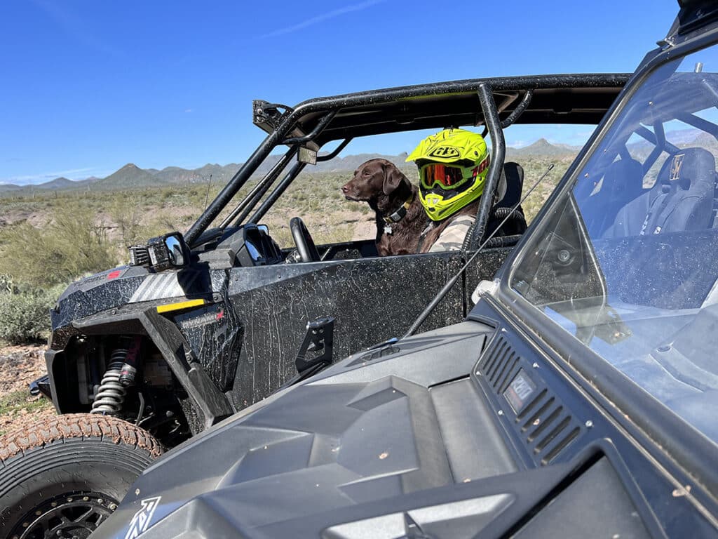 Charlie and her mom in their RZR